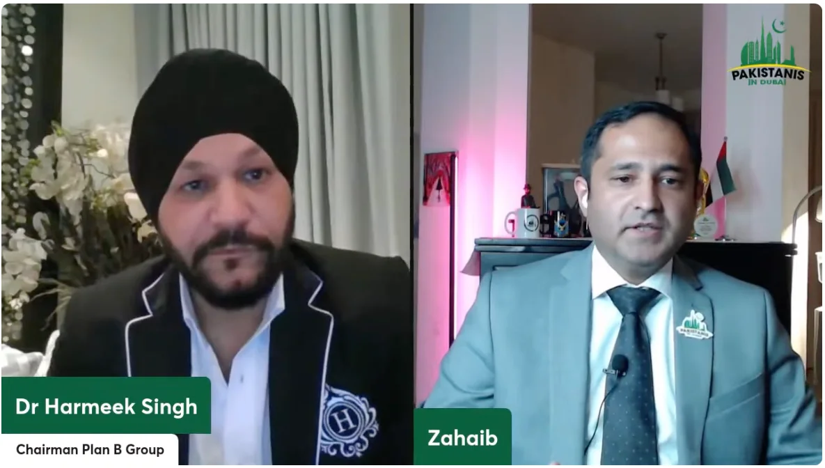 A video interview for the Pakistanis in Dubai community, shown as two men side by side in a split-screen frame, with the group logo in the top corner.